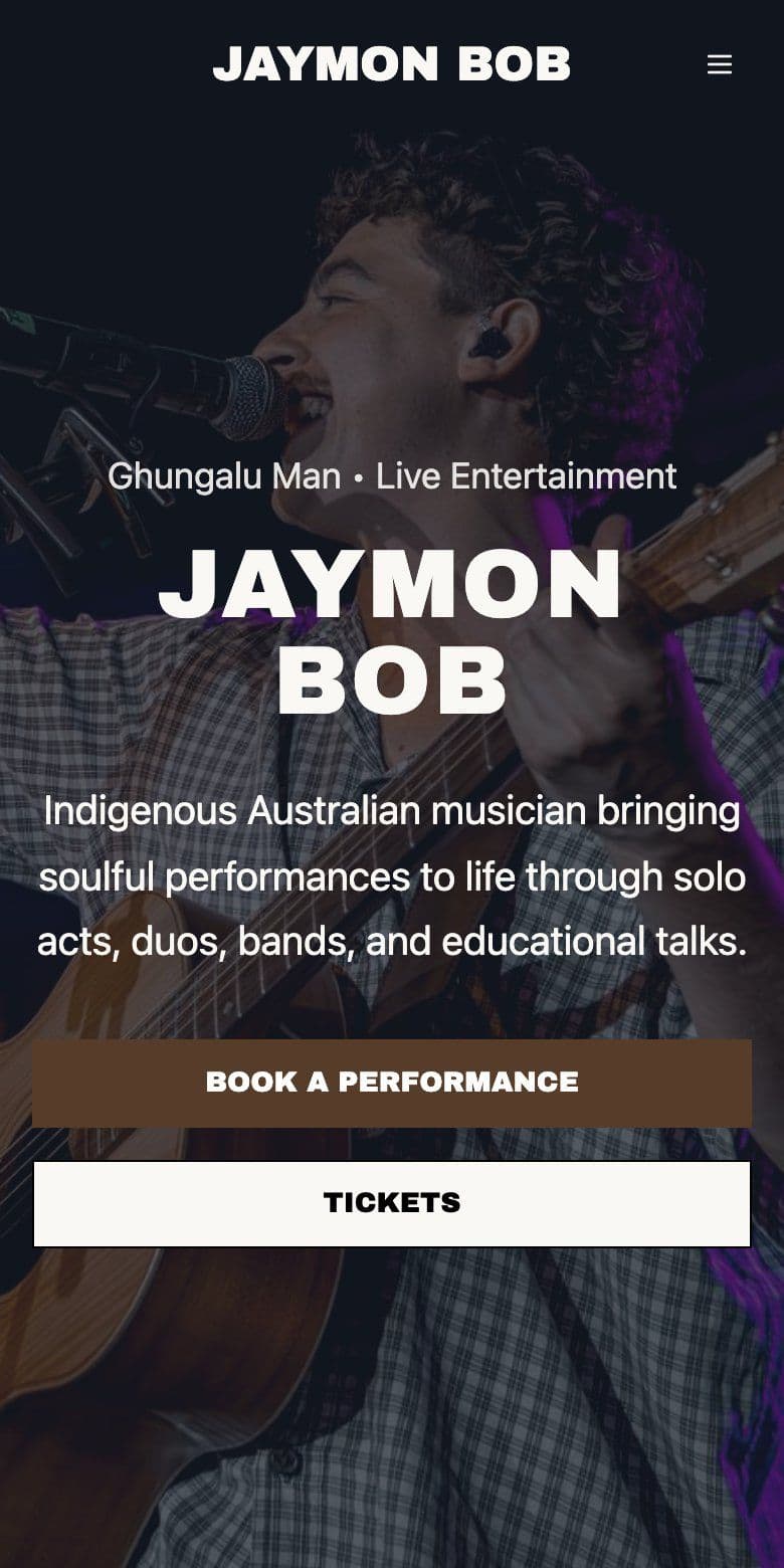 The Jaymon Bob homepage on a phone with Book a Performance and Tickets buttons.